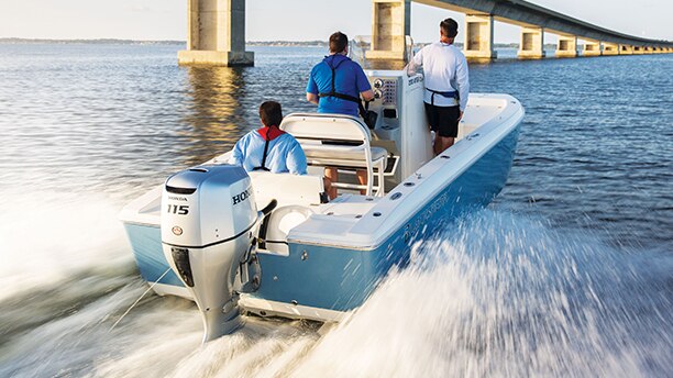 Three people in a speedboat taking off 